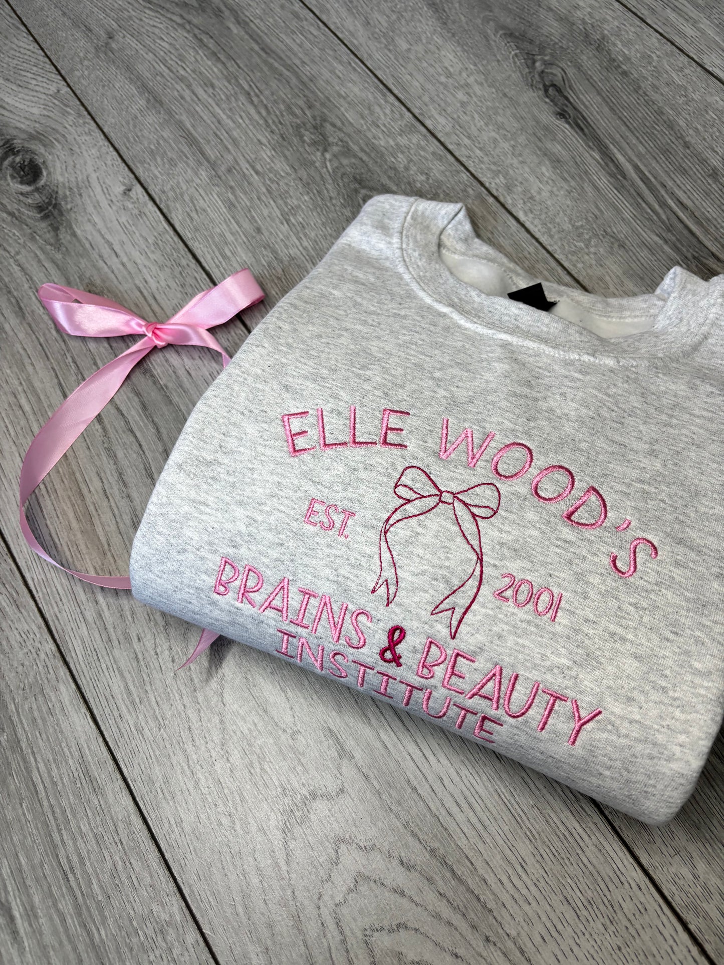 ELLE WOODS BRAINS & BEAUTY INSTITUTE EMBROIDERED SWEATSHIRT
