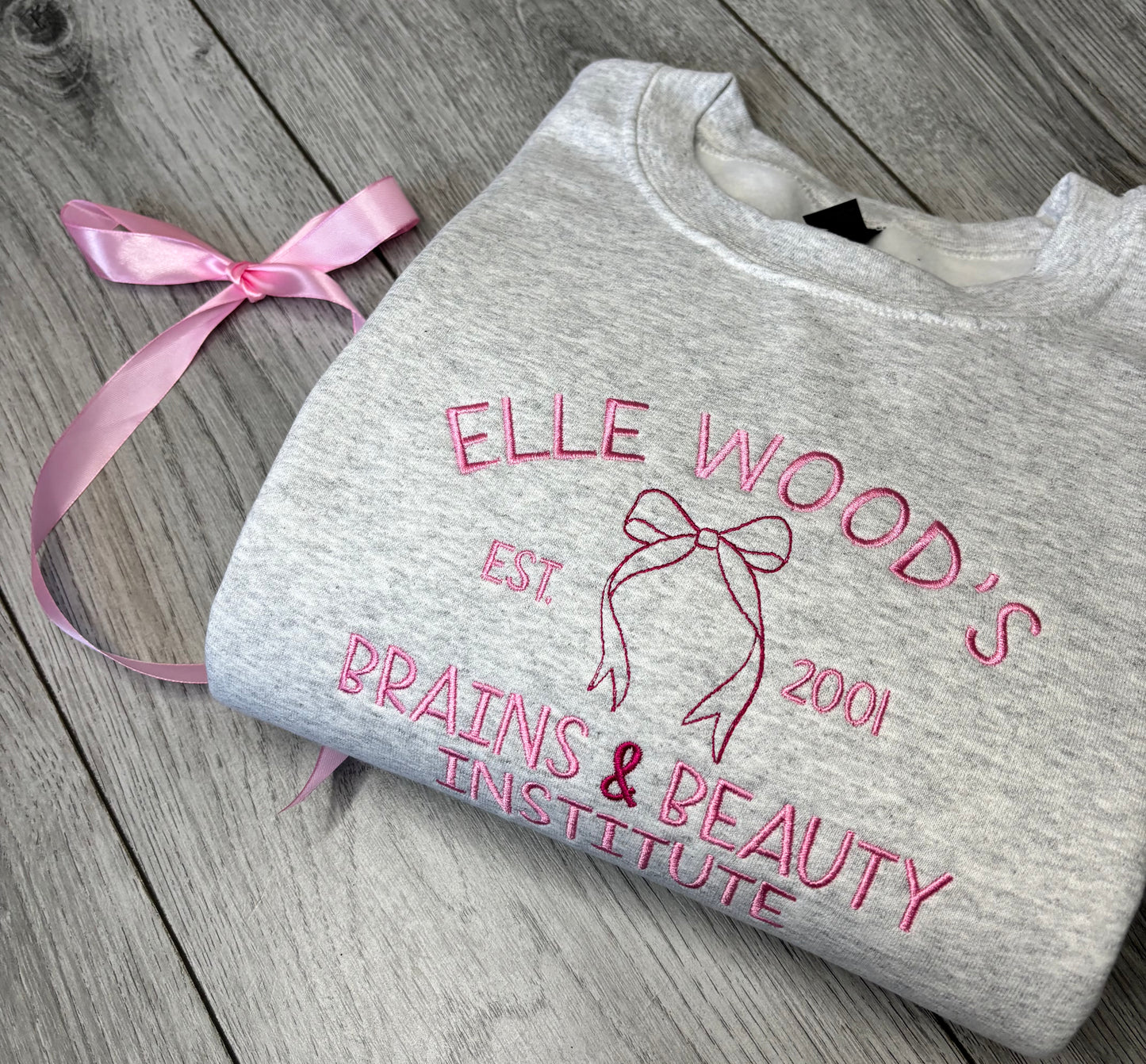ELLE WOODS BRAINS & BEAUTY INSTITUTE EMBROIDERED SWEATSHIRT