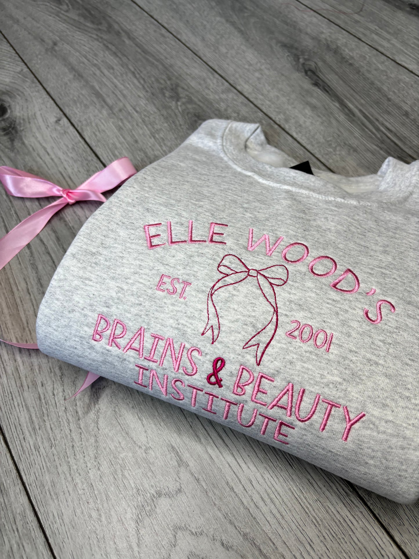 ELLE WOODS BRAINS & BEAUTY INSTITUTE EMBROIDERED SWEATSHIRT