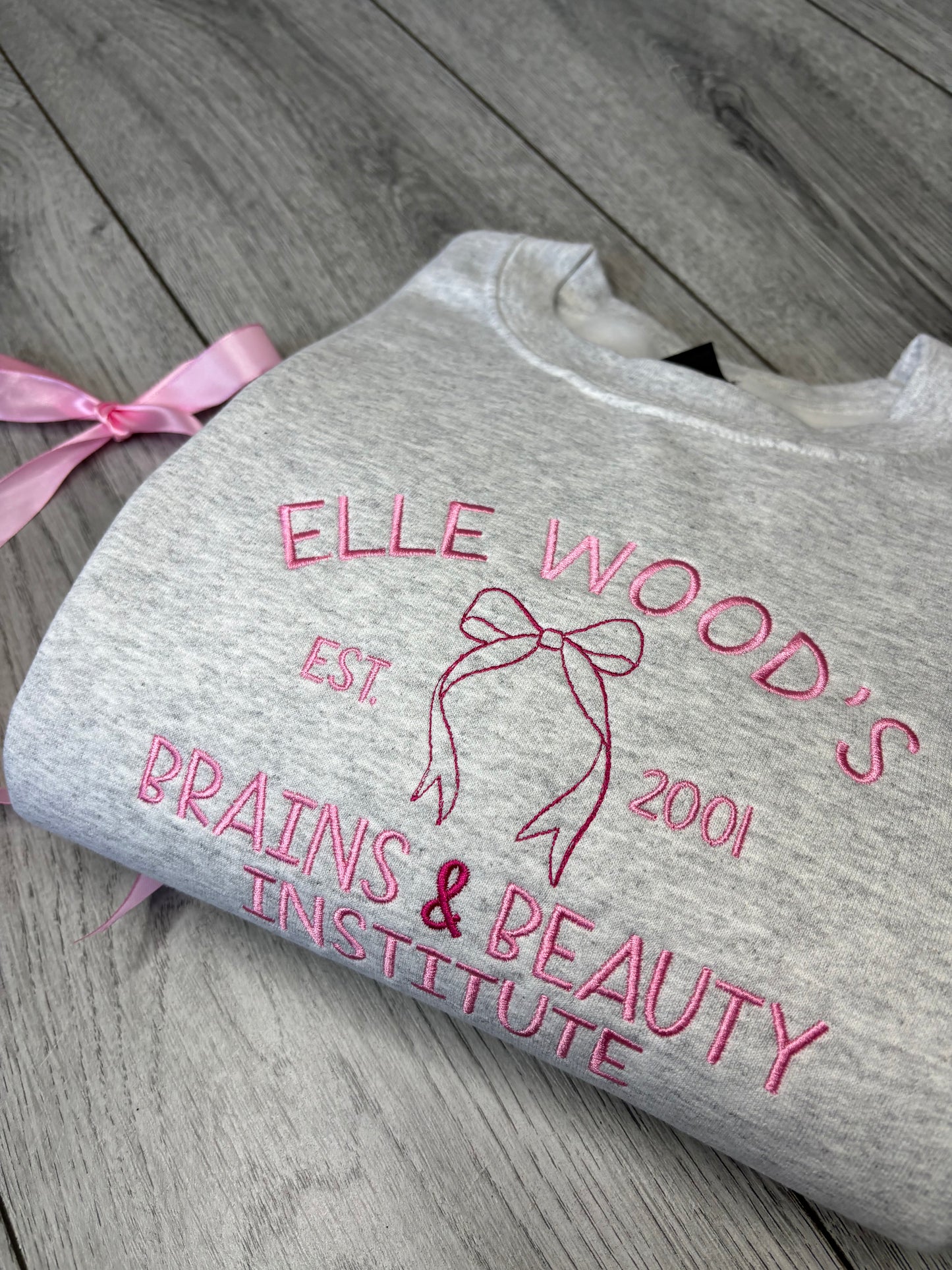 ELLE WOODS BRAINS & BEAUTY INSTITUTE EMBROIDERED SWEATSHIRT