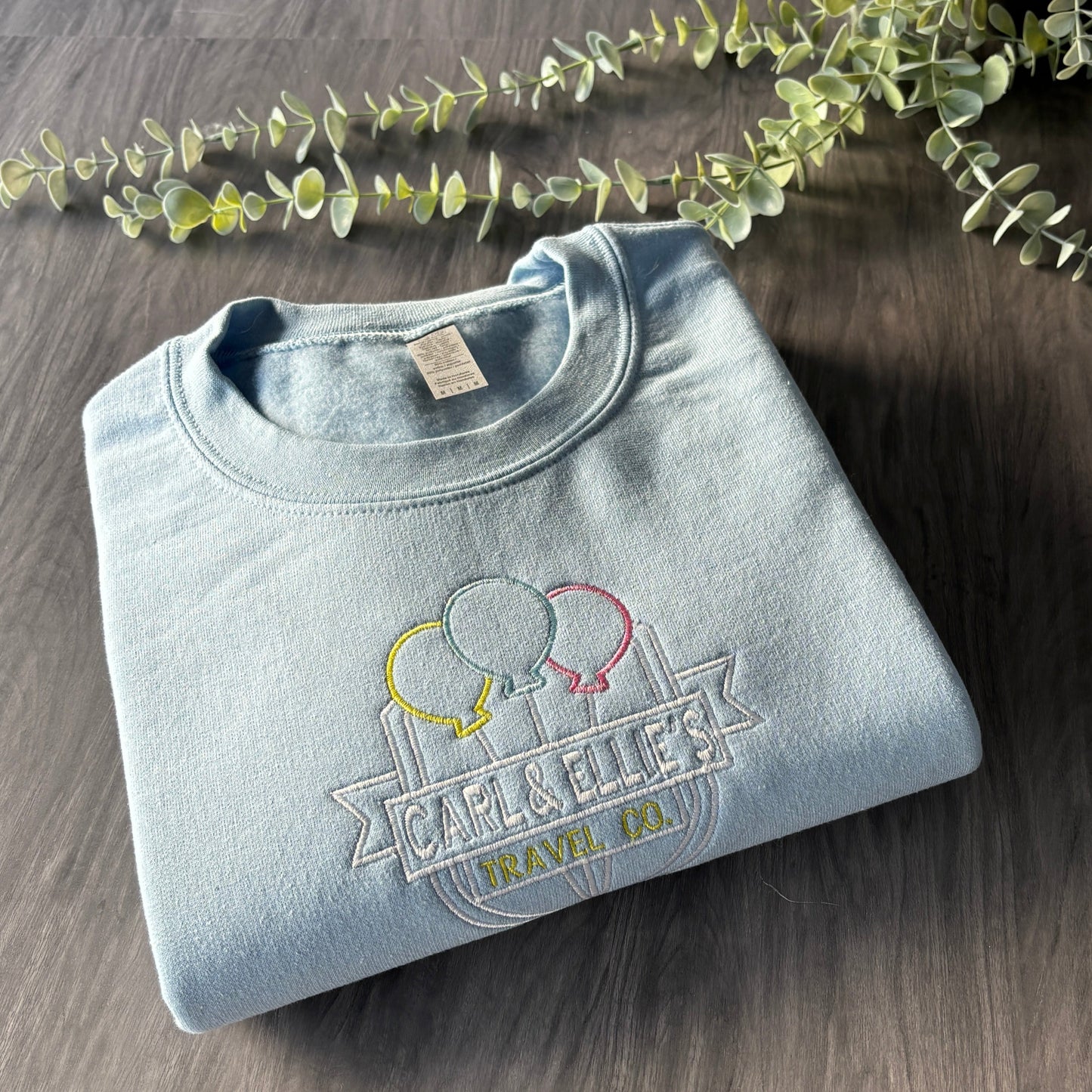 CARL & ELLIE TRAVEL CO EMBROIDERED SWEATSHIRT