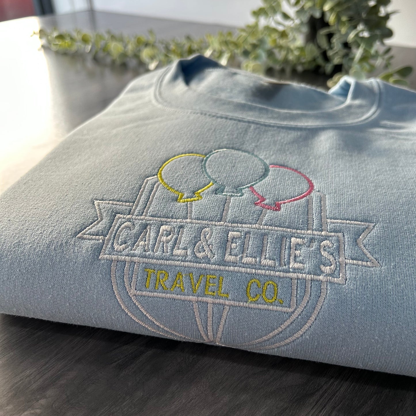 CARL & ELLIE TRAVEL CO EMBROIDERED SWEATSHIRT