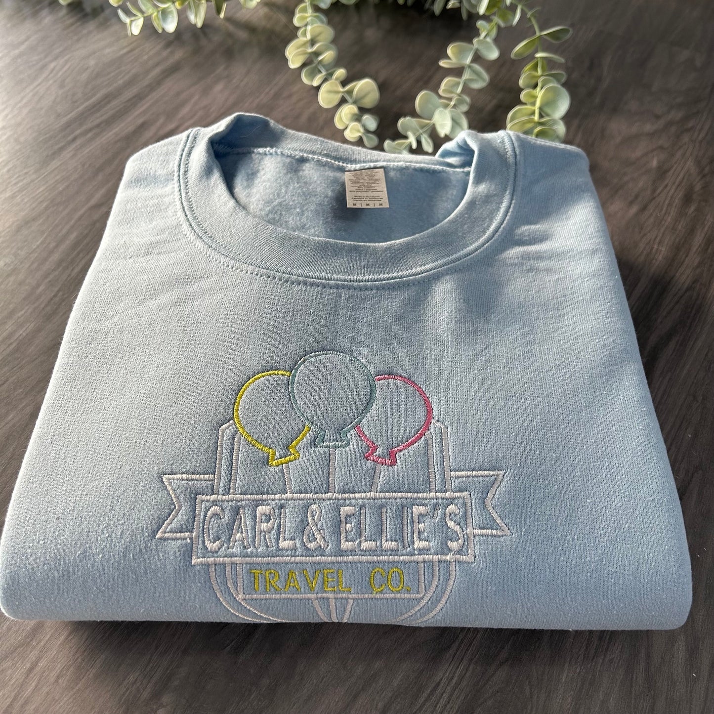 CARL & ELLIE TRAVEL CO EMBROIDERED SWEATSHIRT