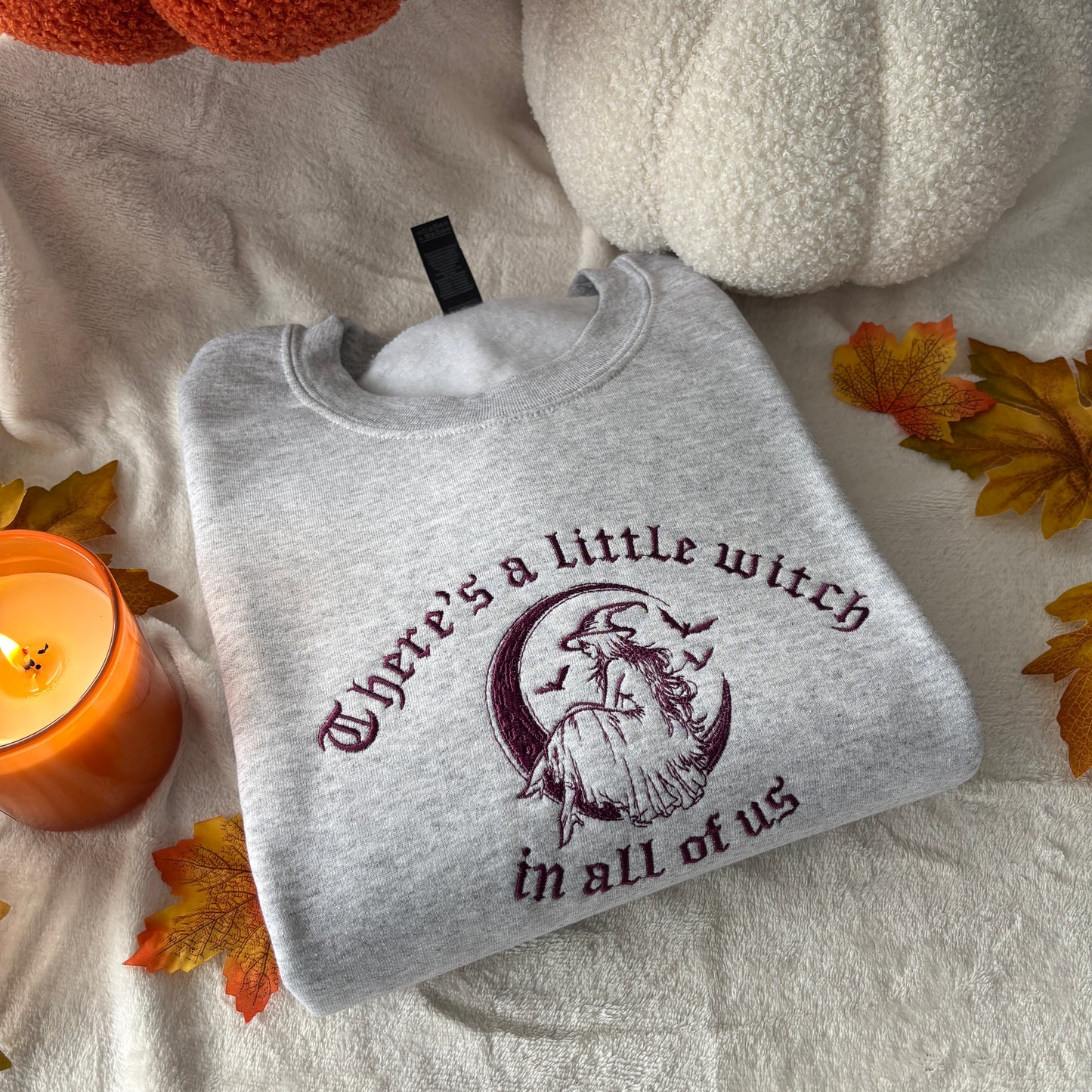 THERE'S A LITTLE WITCH IN ALL OF US EMBROIDERED SWEATSHIRT