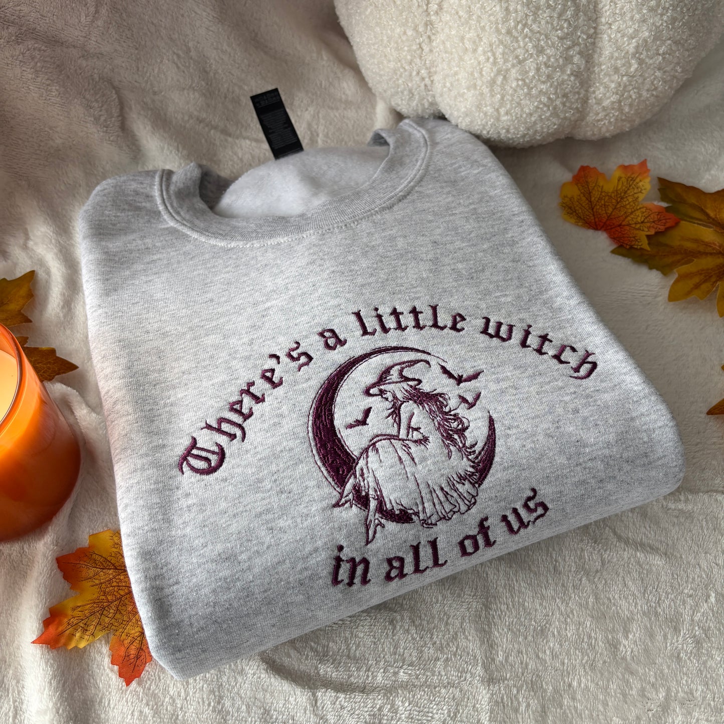 THERE'S A LITTLE WITCH IN ALL OF US EMBROIDERED SWEATSHIRT