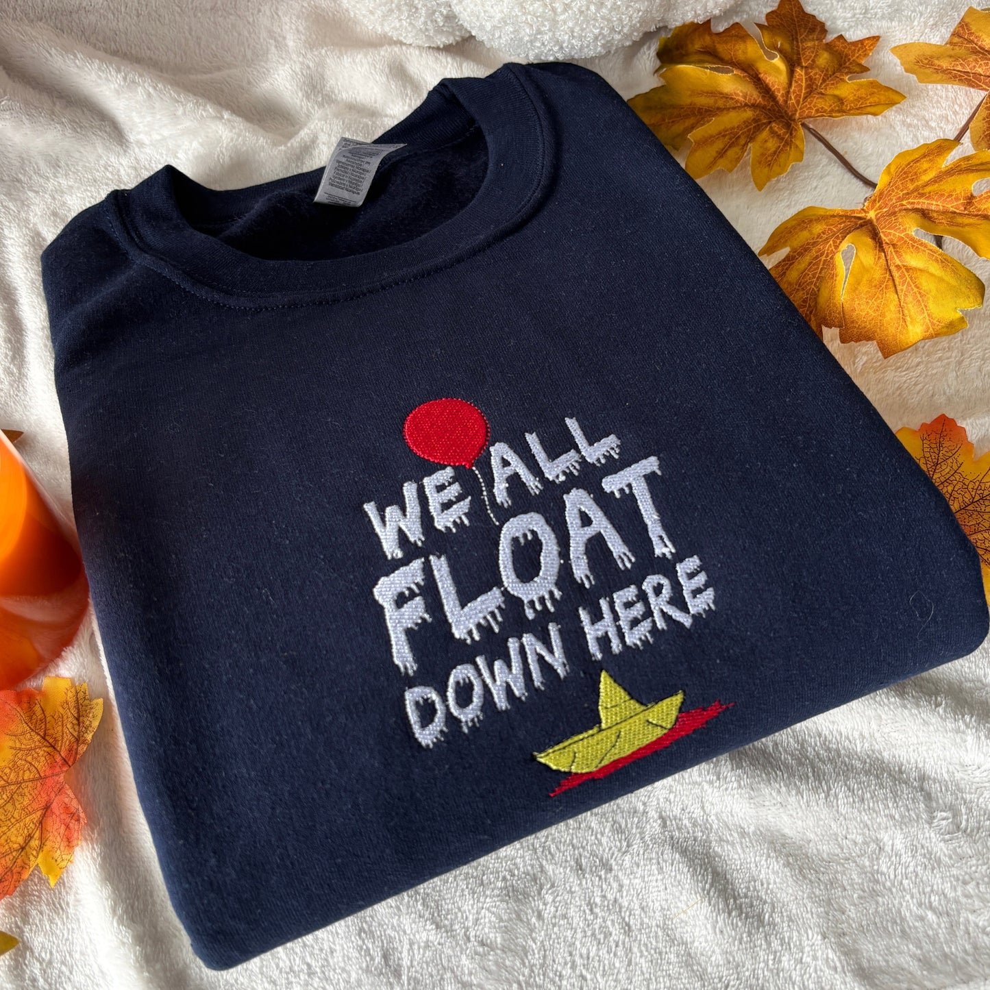 WE ALL FLOAT EMBROIDERED SWEATSHIRT