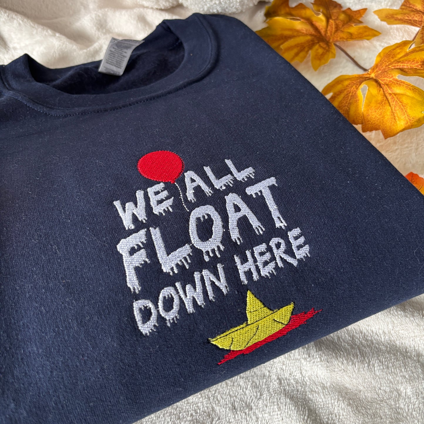 WE ALL FLOAT EMBROIDERED SWEATSHIRT