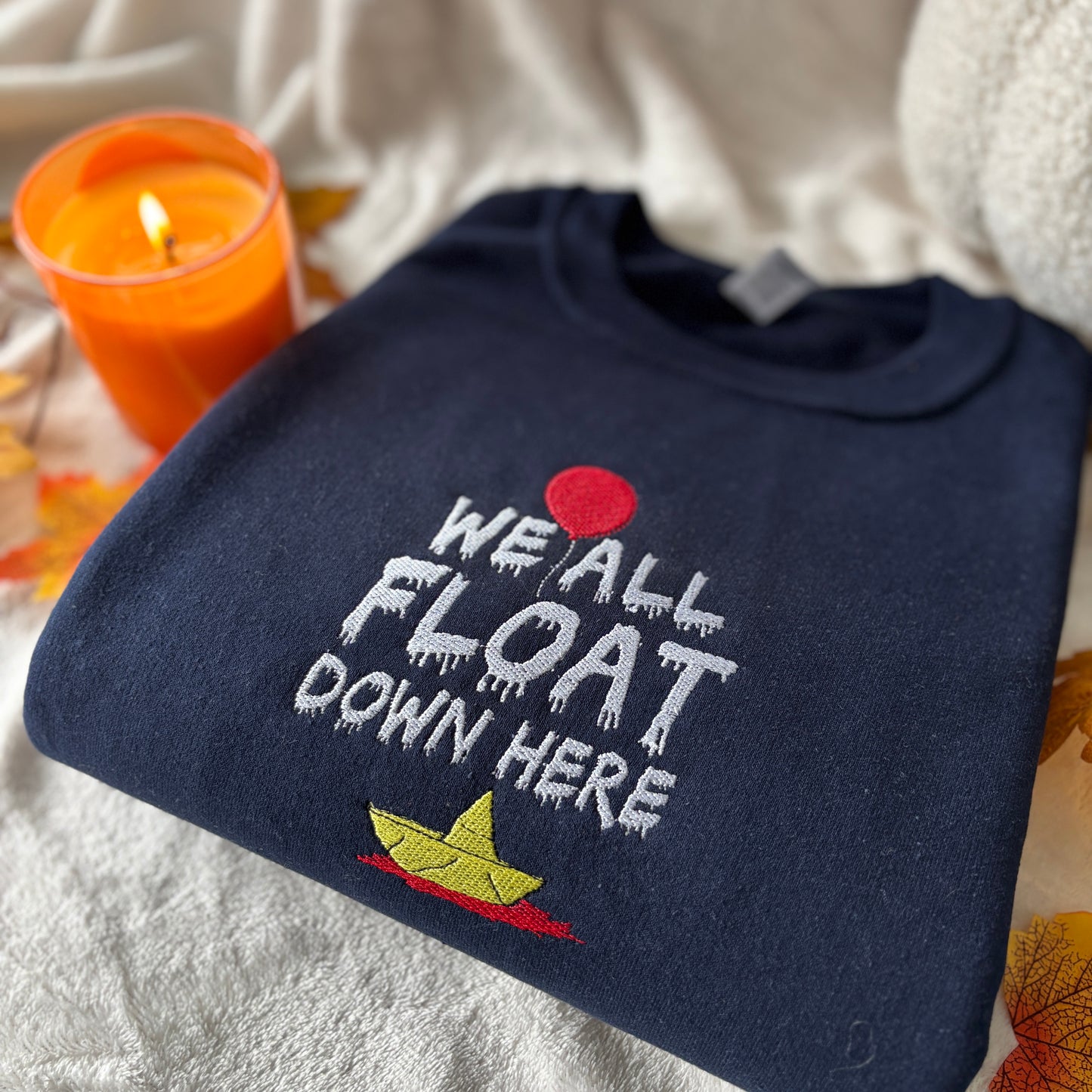 WE ALL FLOAT EMBROIDERED SWEATSHIRT