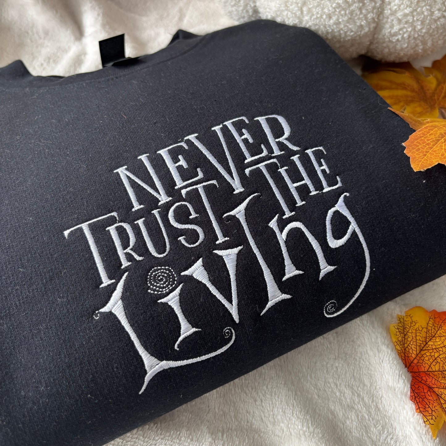 NEVER TRUST THE LIVING EMBROIDERED SWEATSHIRT