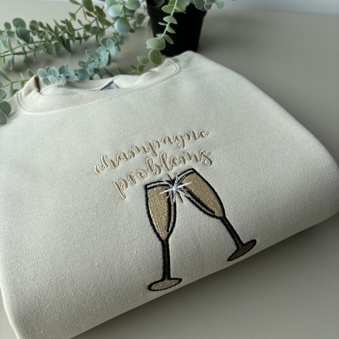 CHAMPAGNE PROBLEMS EMBROIDERED SWEATSHIRT