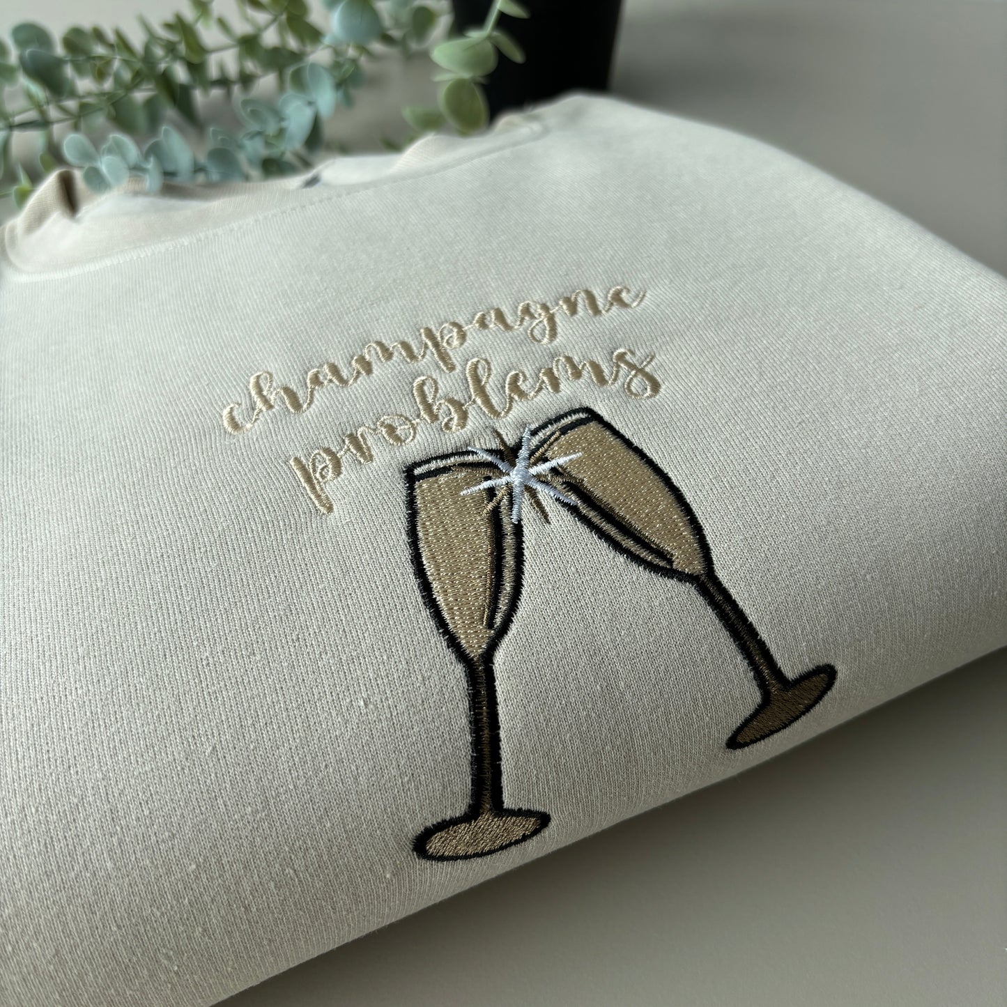 CHAMPAGNE PROBLEMS EMBROIDERED SWEATSHIRT