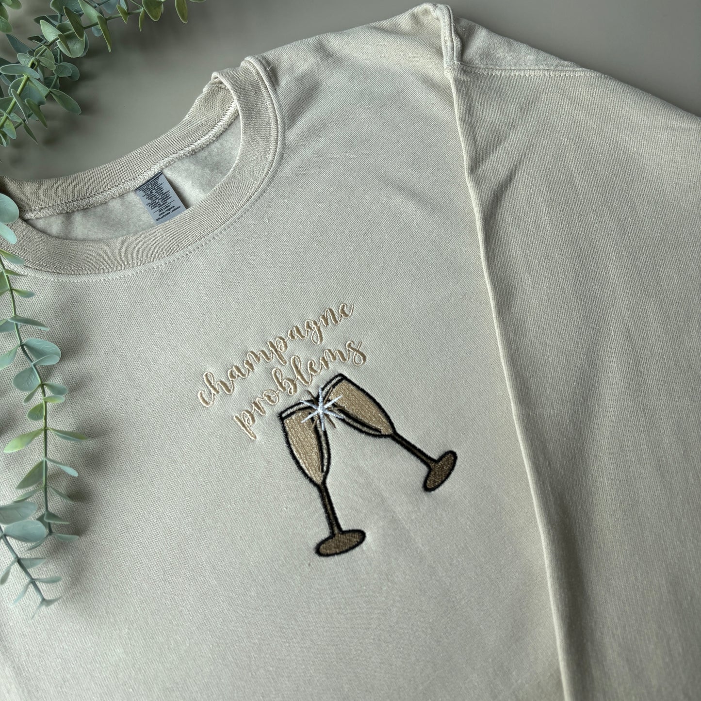 CHAMPAGNE PROBLEMS EMBROIDERED SWEATSHIRT