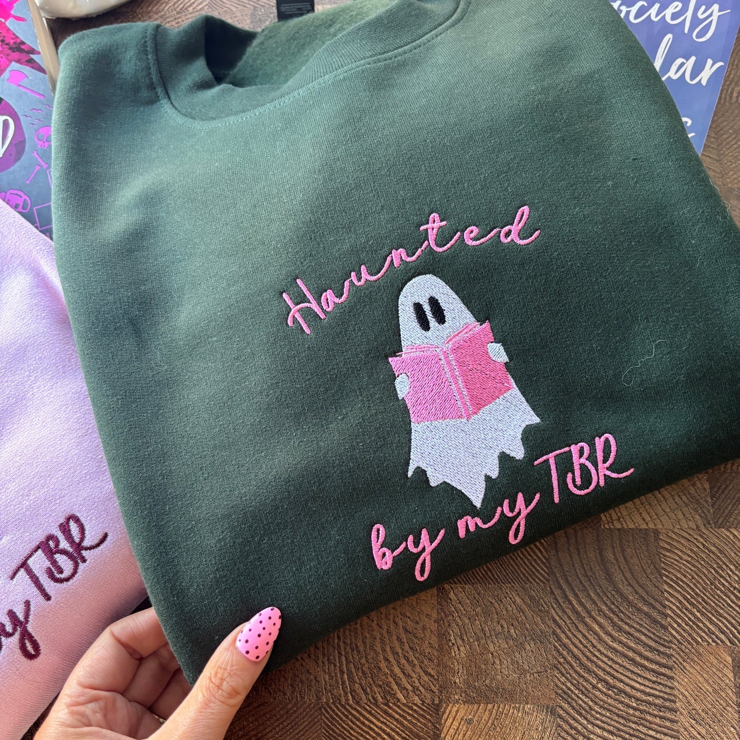 HAUNTED BY MY TBR EMBROIDERED SWEATSHIRT