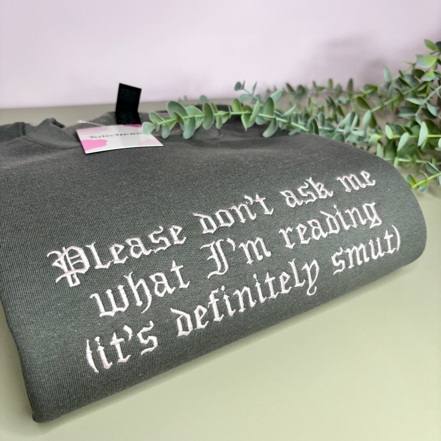DON'T ASK WHAT I'M READING EMBROIDERED SWEATSHIRT