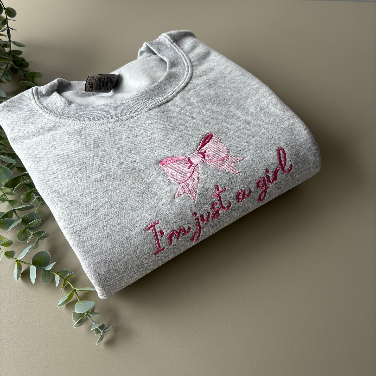 JUST A GIRL EMBROIDERED SWEATSHIRT