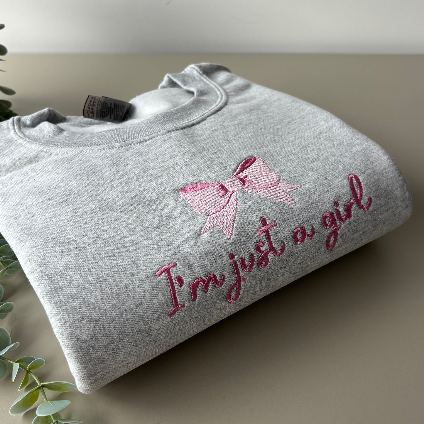 JUST A GIRL EMBROIDERED SWEATSHIRT