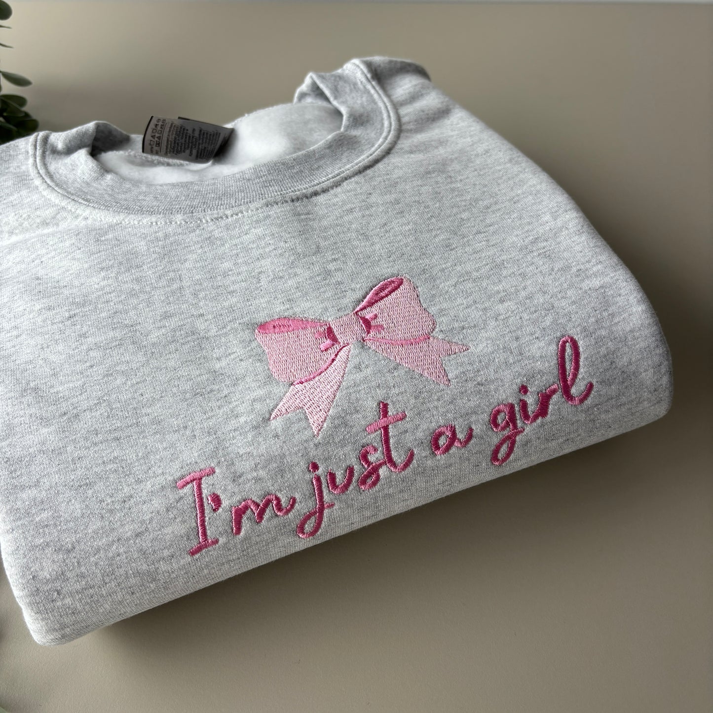 JUST A GIRL EMBROIDERED SWEATSHIRT