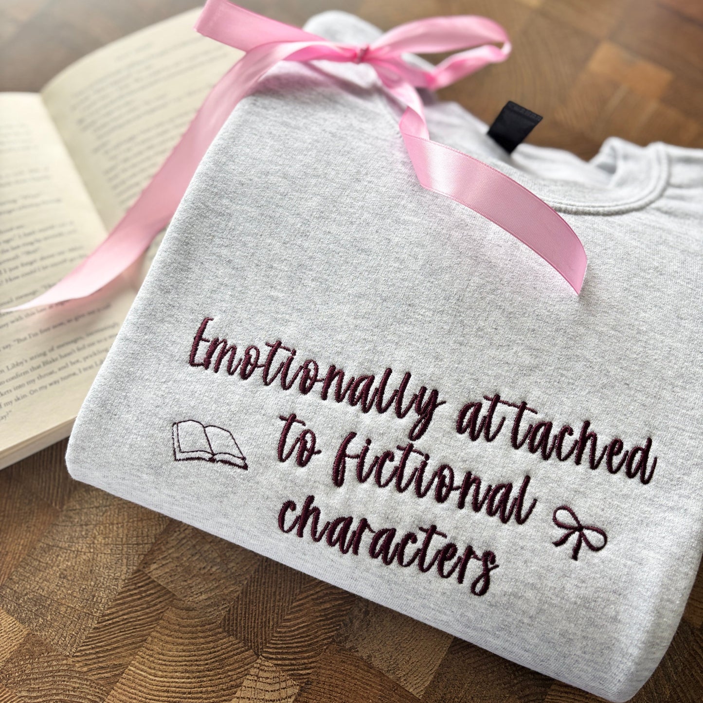 EMOTIONALLY ATTACHED TO FICTIONAL CHARACTERS EMBROIDERED SWEATSHIRT