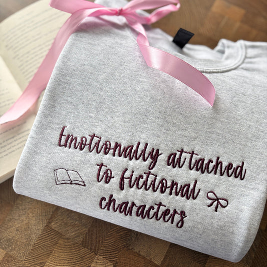 EMOTIONALLY ATTACHED TO FICTIONAL CHARACTERS EMBROIDERED SWEATSHIRT