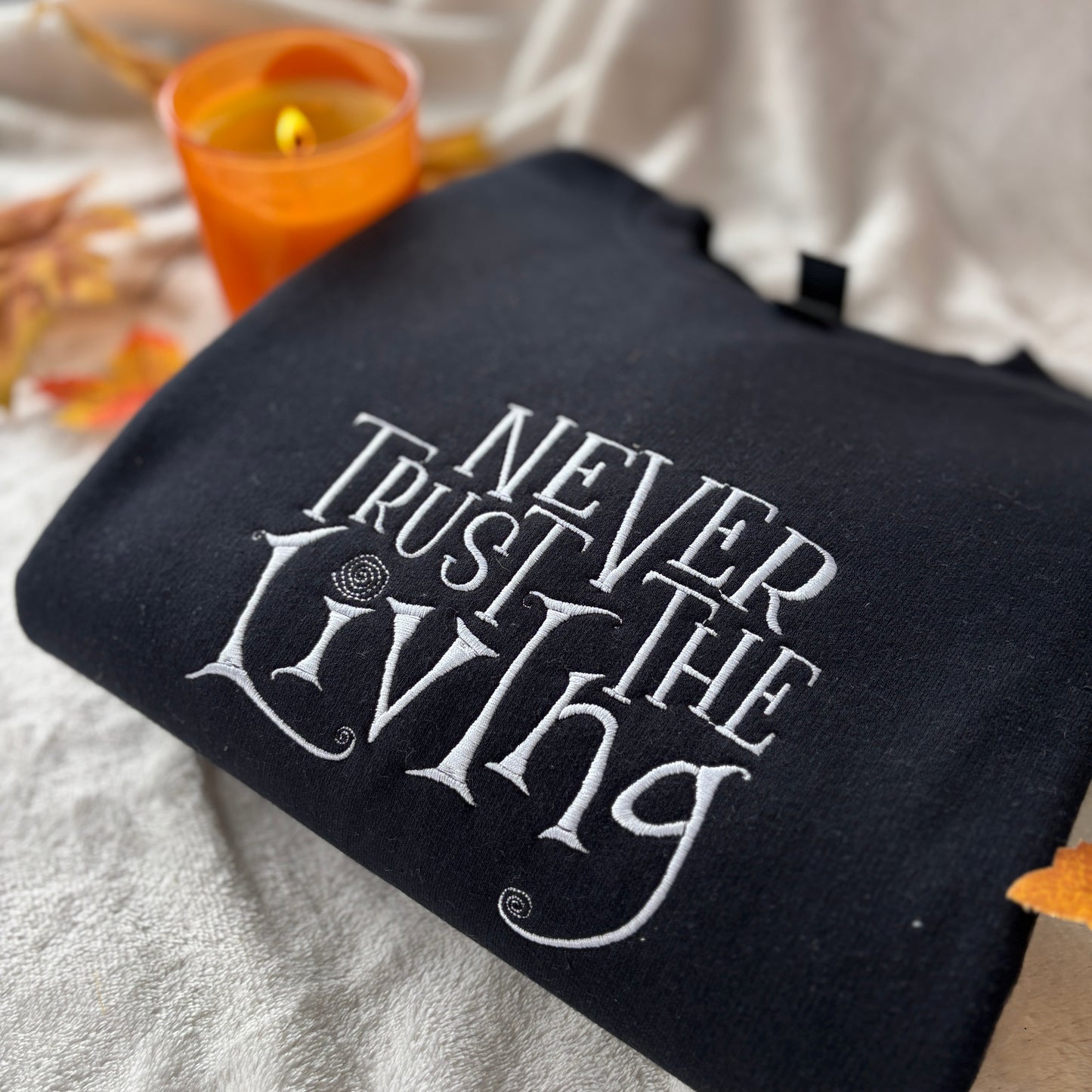 NEVER TRUST THE LIVING EMBROIDERED SWEATSHIRT