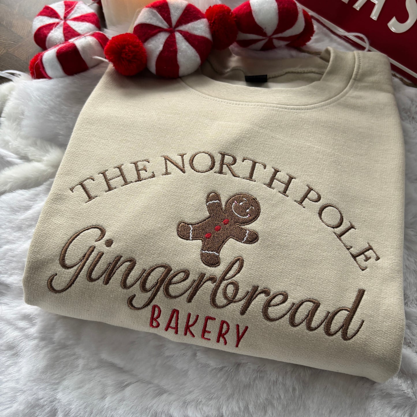 NORTH POLE GINGERBREAD BAKERY EMBROIDERED SWEATSHIRT