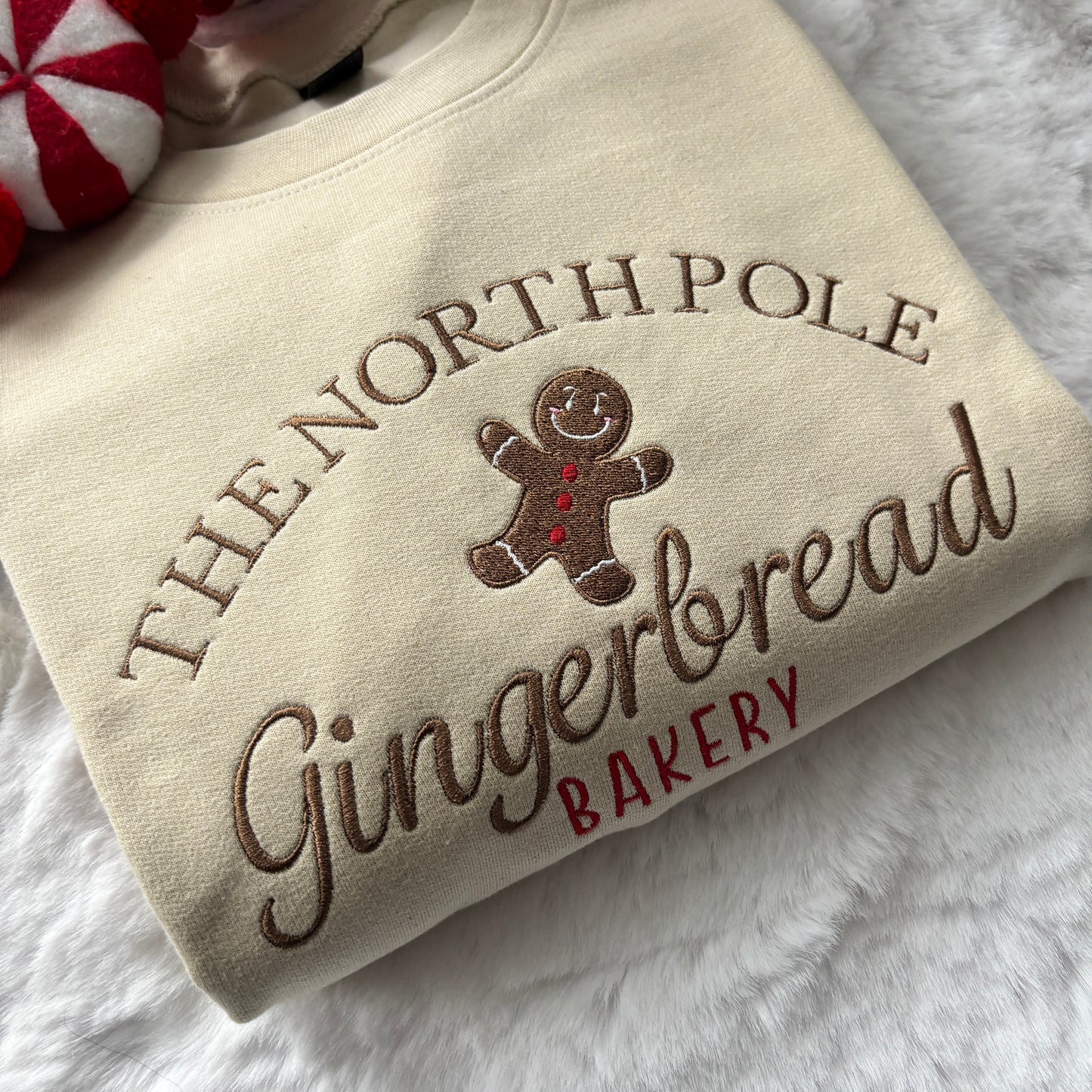 NORTH POLE GINGERBREAD BAKERY EMBROIDERED SWEATSHIRT