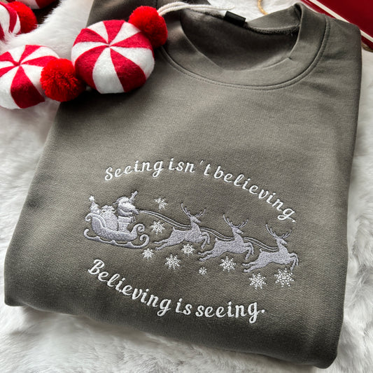 SEEING ISN'T BELIEVING SANTA CLAUSE EMBROIDERED SWEATSHIRT