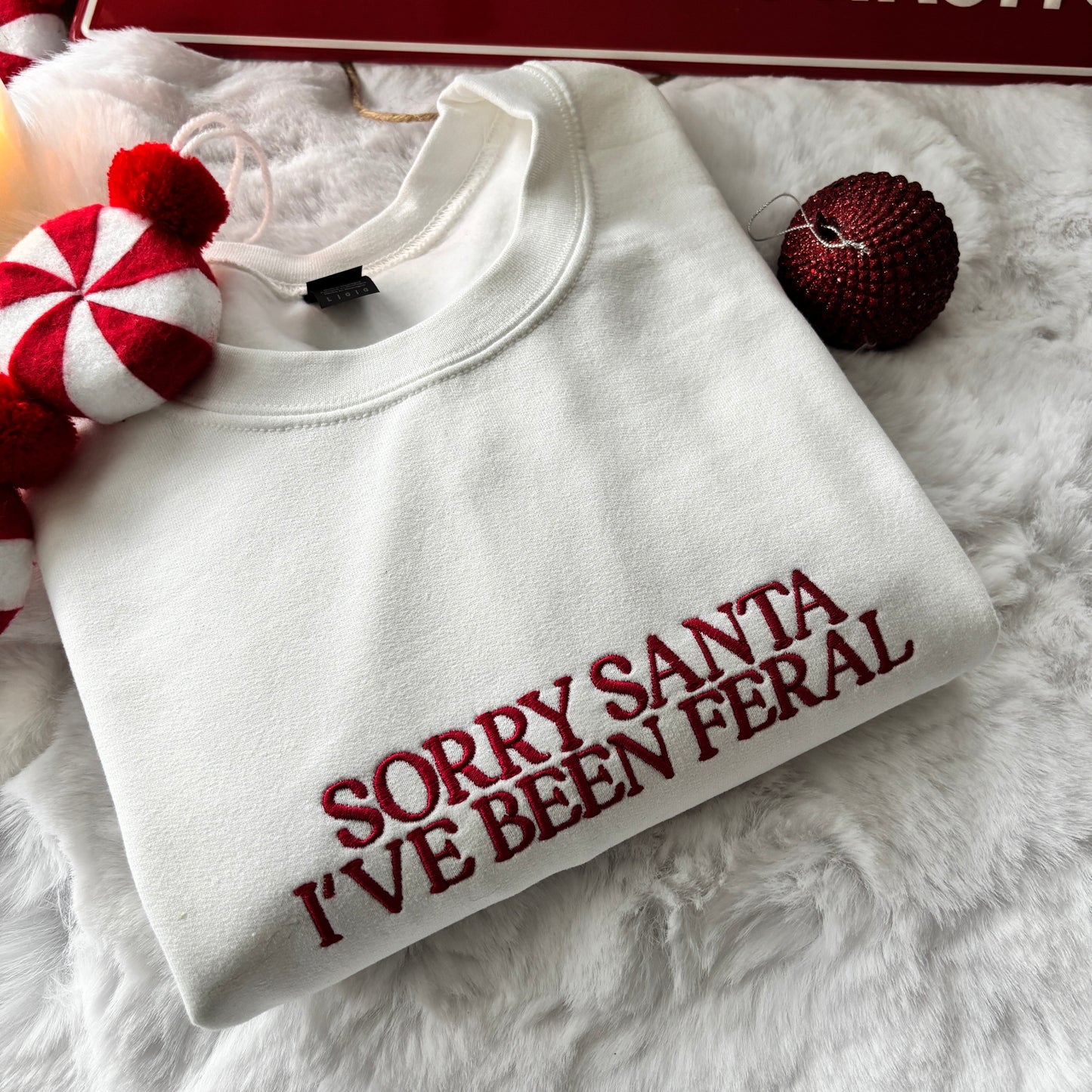 SORRY SANTA I'VE BEEN FERAL EMBROIDERED SWEATSHIRT
