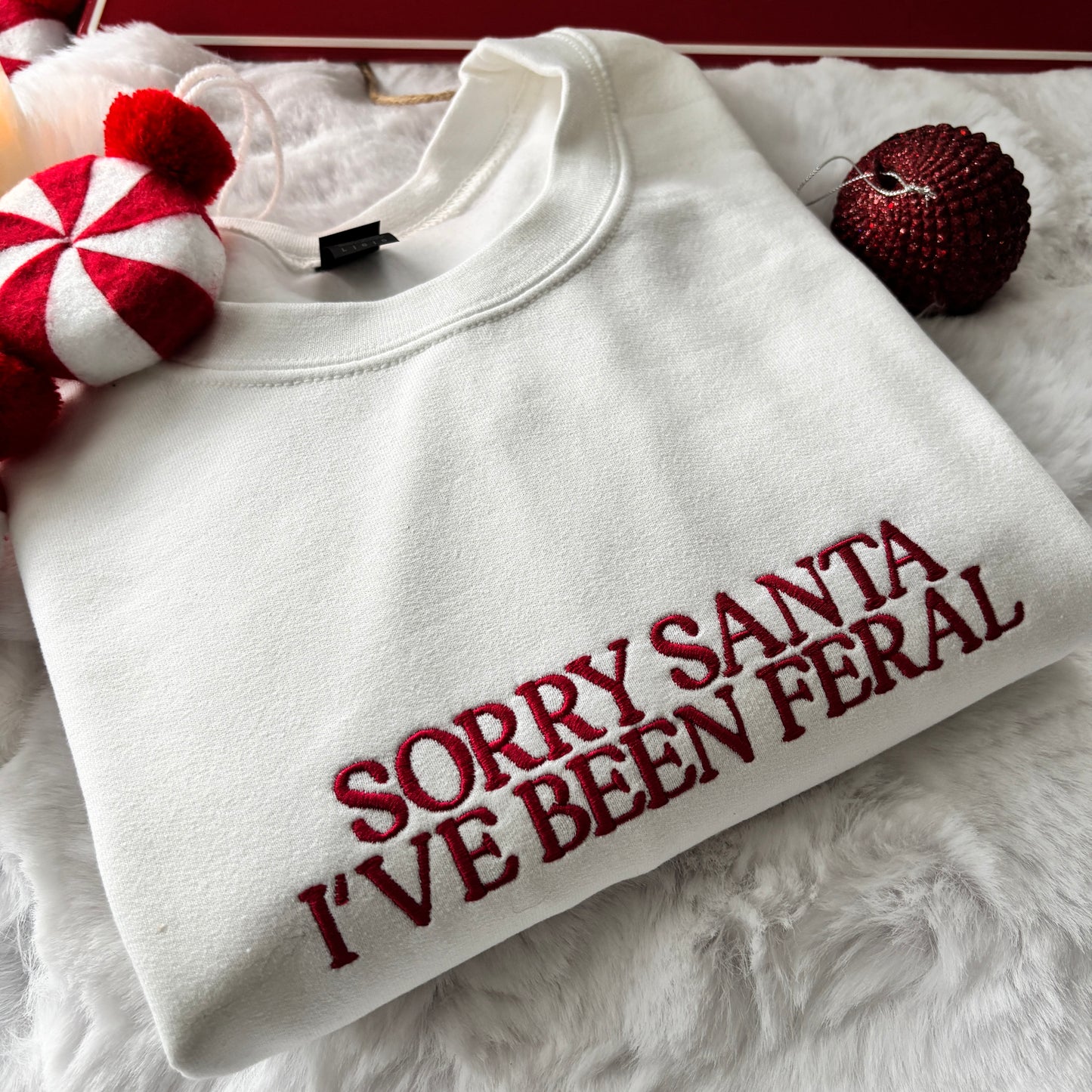 SORRY SANTA I'VE BEEN FERAL EMBROIDERED SWEATSHIRT