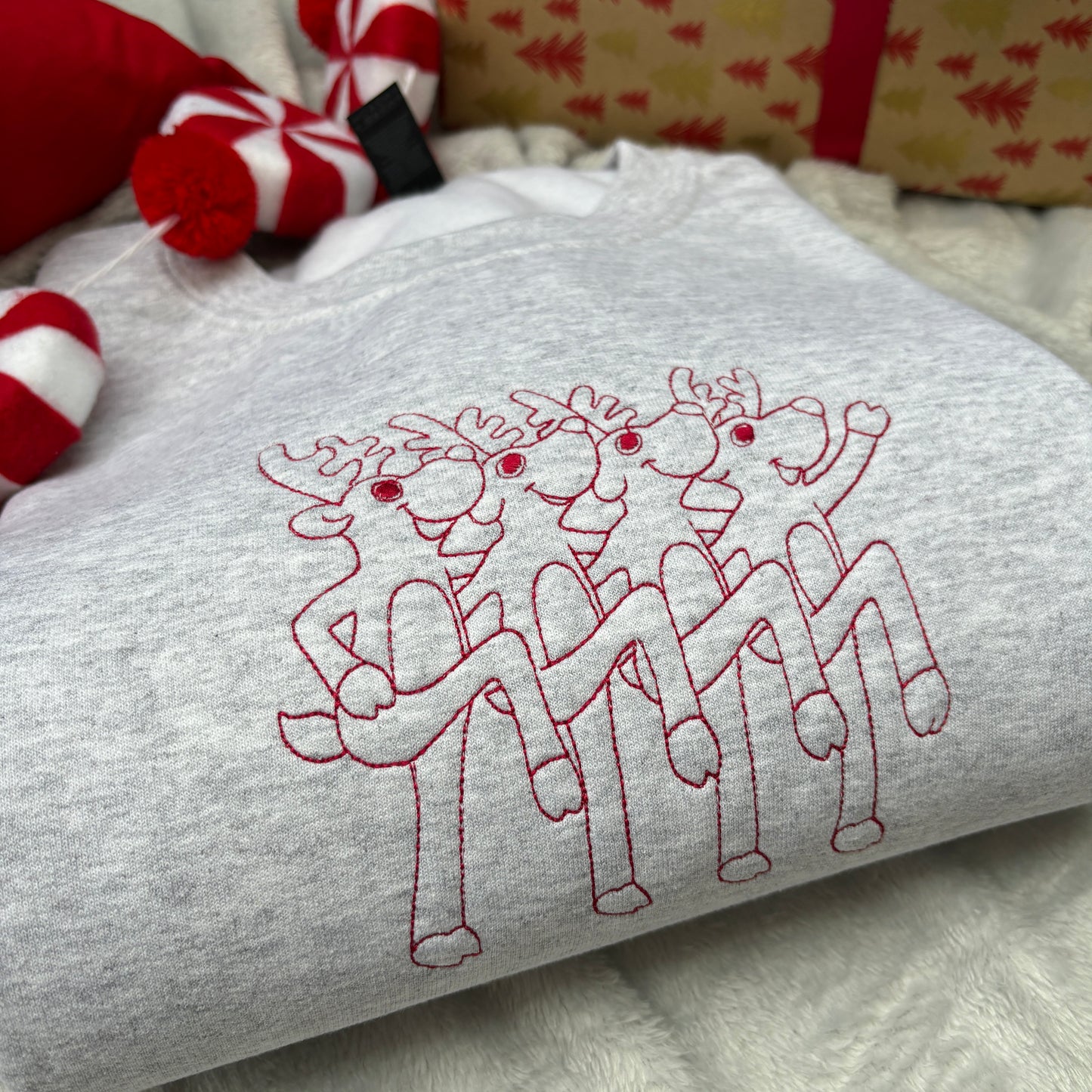 DANCING REINDEER EMBROIDERED SWEATSHIRT